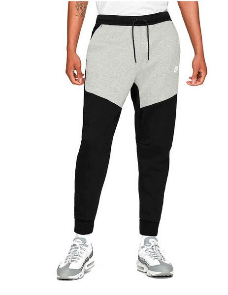 pantaloni tech grigi e neri